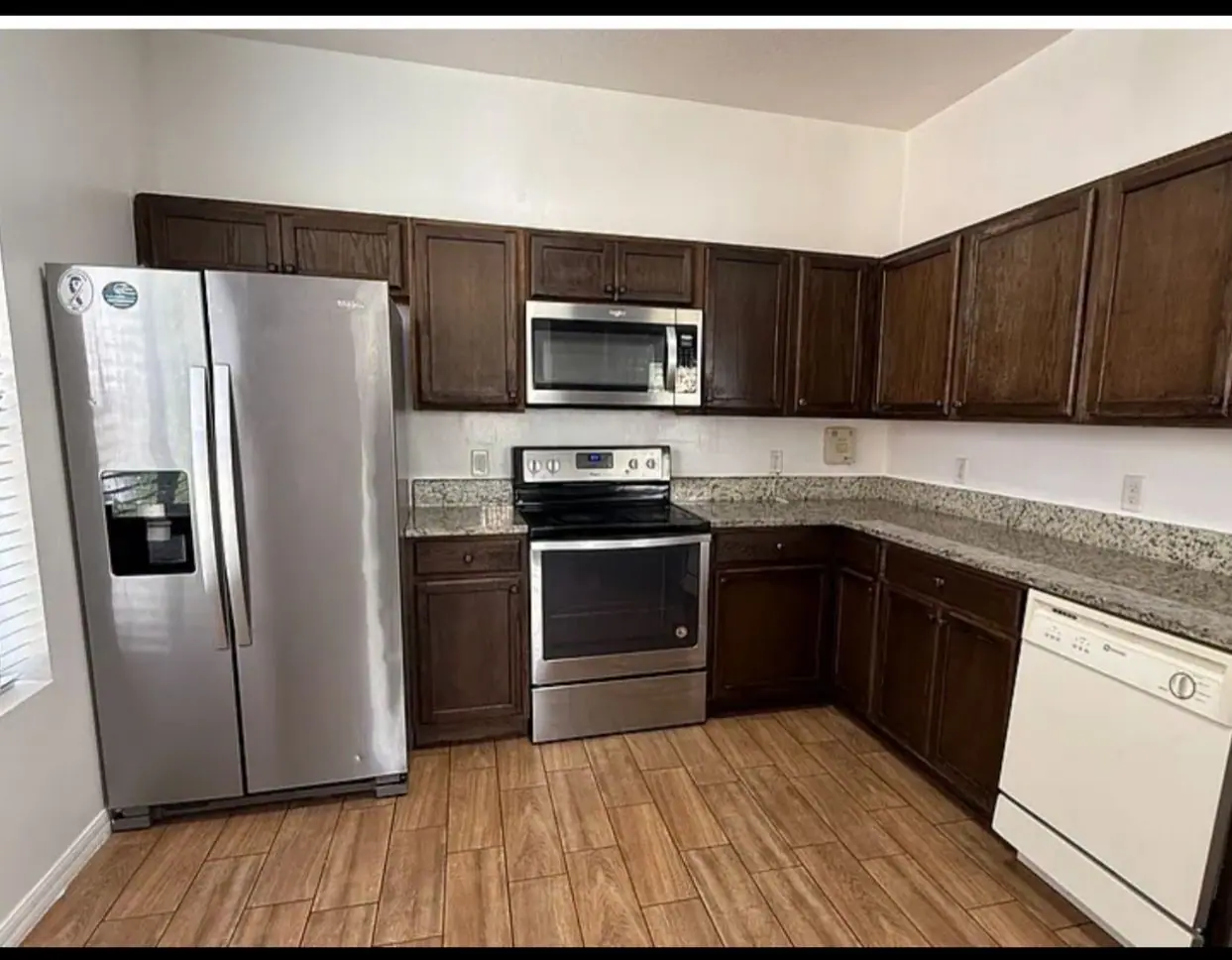 Kitchen with dark espresso cabinets before painting