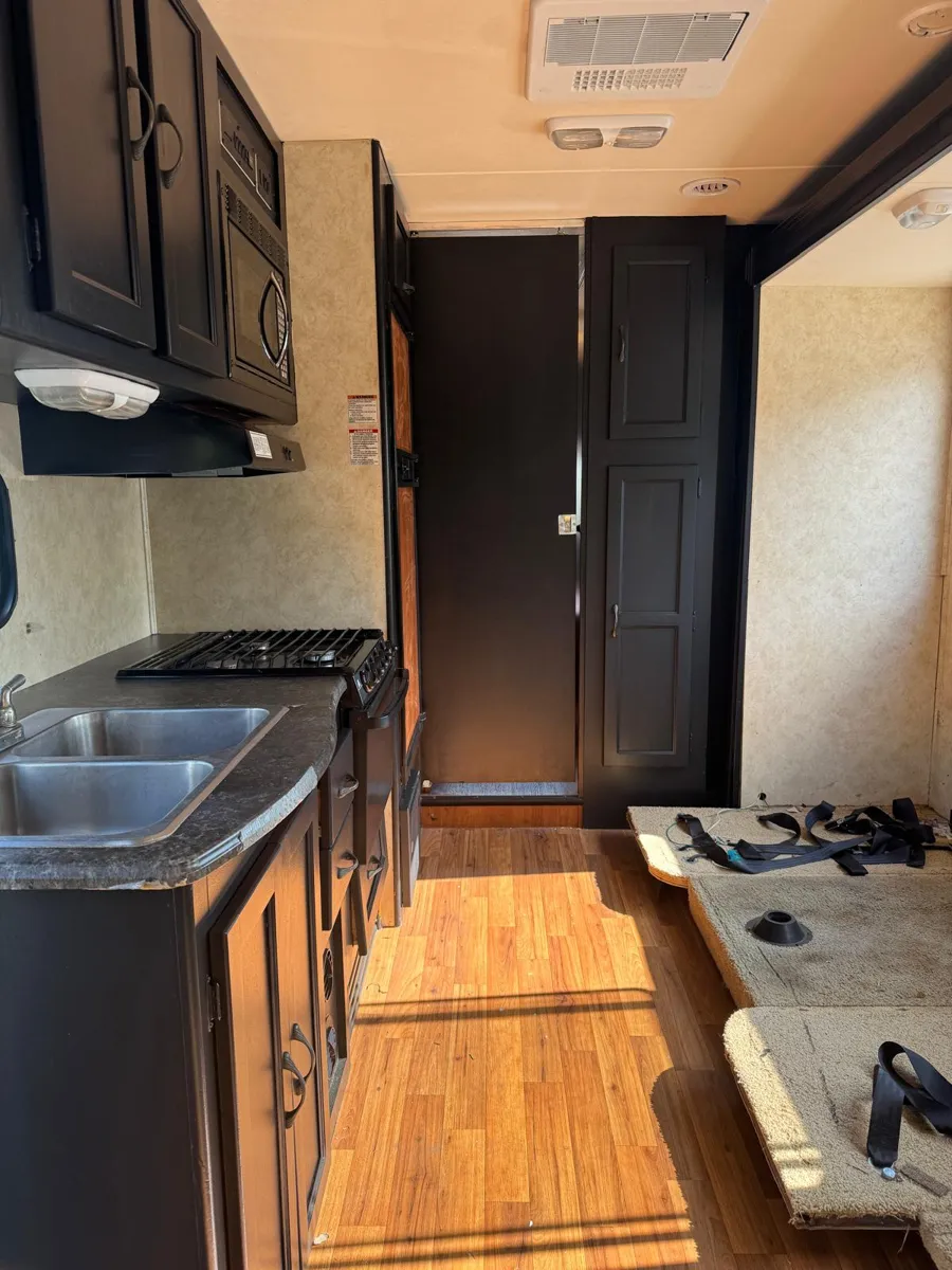 Black motorhome cabinets by BR Painting